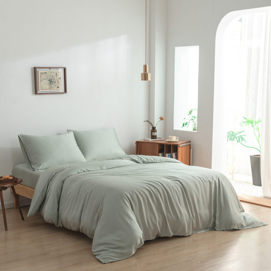 Foto van zijaanzicht van beddengoed opgemaakt op een bed Sage Green op een bed (kleur licht groen)